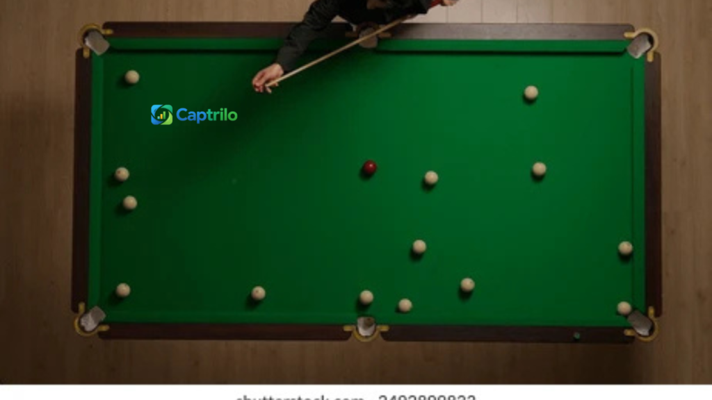 Players enjoying a stylish pool table game with billiard balls and cue sticks in a modern lounge setting, perfect for Instagram pool table captions inspiration.