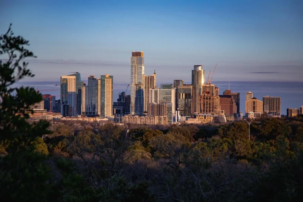 1200+ Austin Instagram captions infographic featuring travel, foodie, skyline, nightlife, funny, aesthetic, short, and romantic ATX caption ideas for photos, reels, and stories in 2026.
